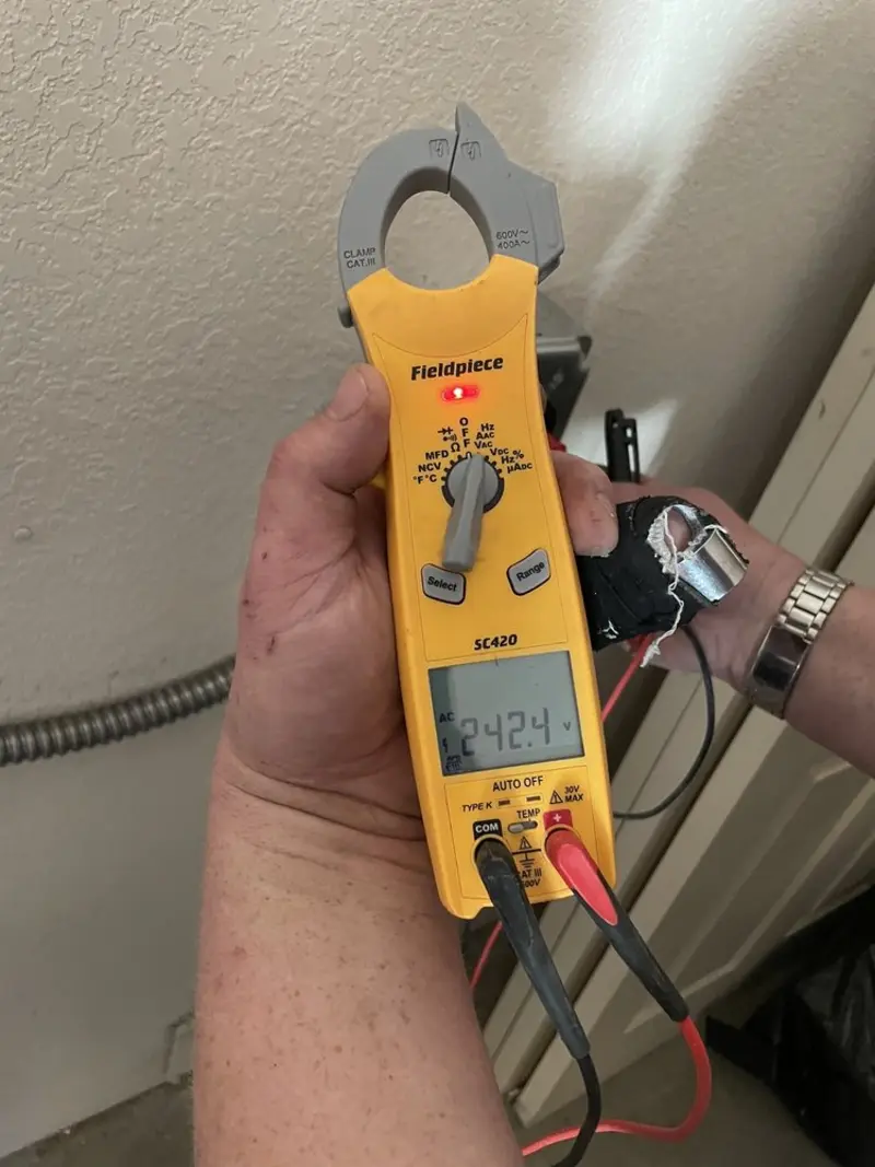 Voltage testing with clamp meter during Ceiling Fan Installation in Pahokee